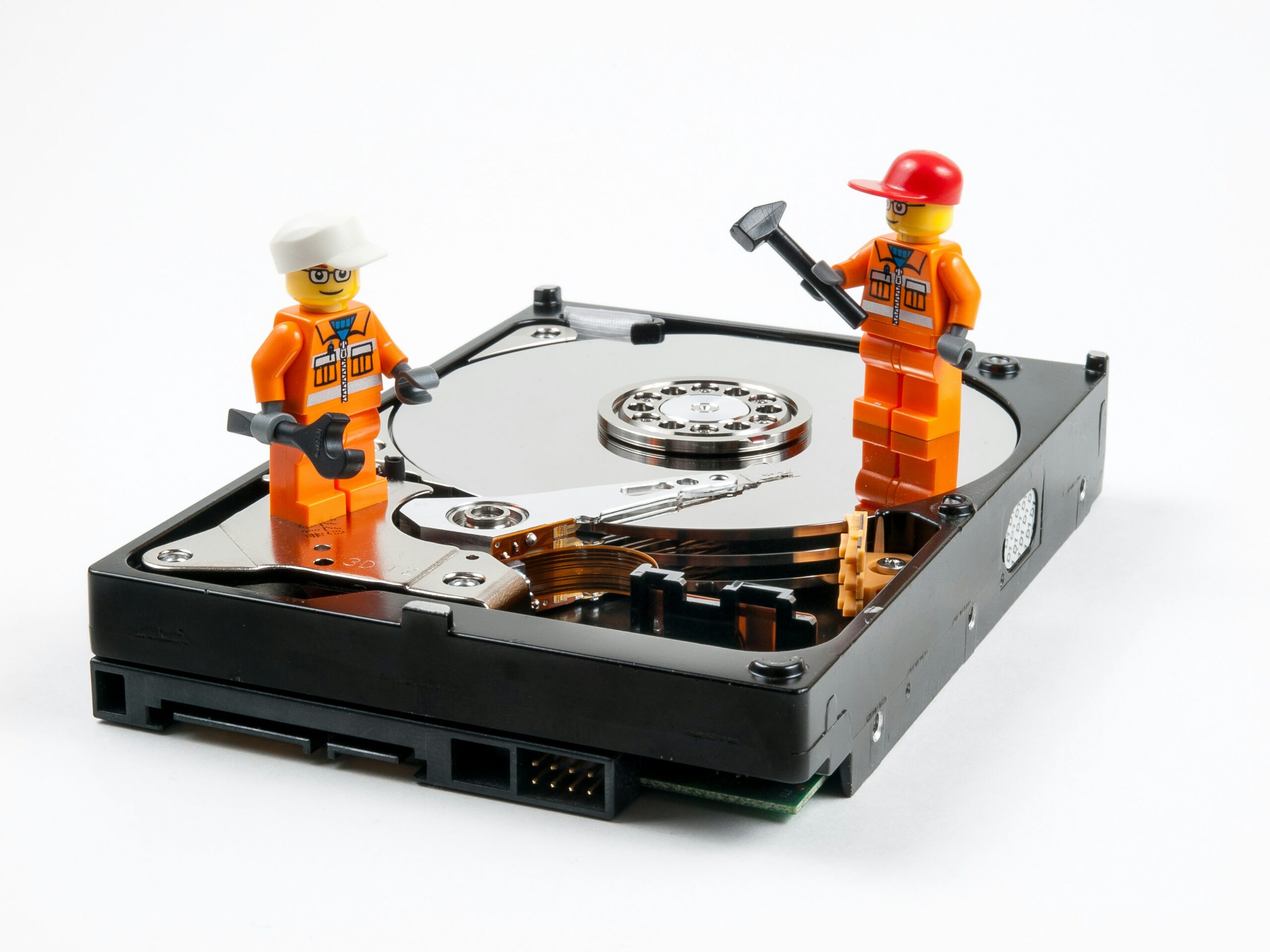 Image of hard drive and men at work